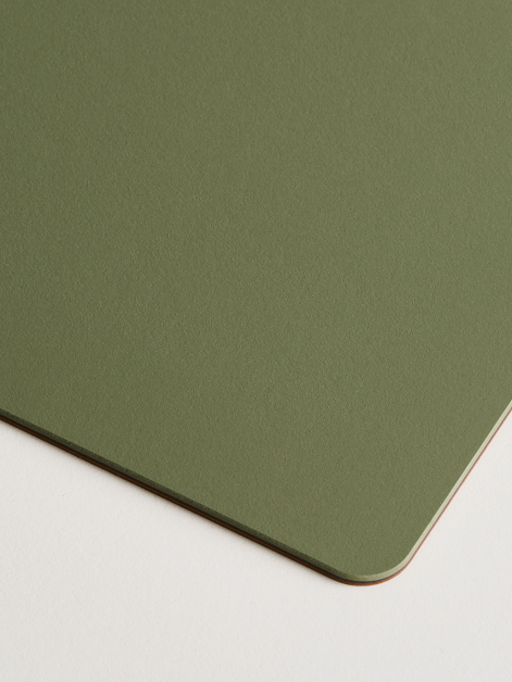 Close-up view of the corner detail of the Faust PAD Mat in 4184 Olive linoleum